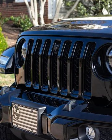 Close-up of a flawless black Jeep grille after detailing